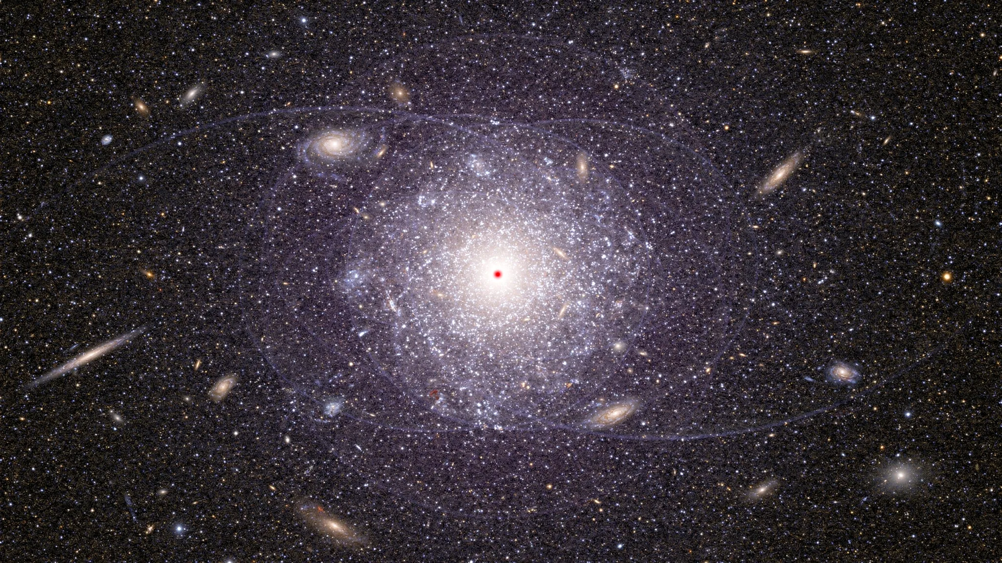 A dense swarm of stars and galaxies around a bright cluster core, a small red point of light at its centre and faint arcs curving around it, in violet tones.